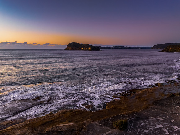 Aerial sunrise over the sea from the headland