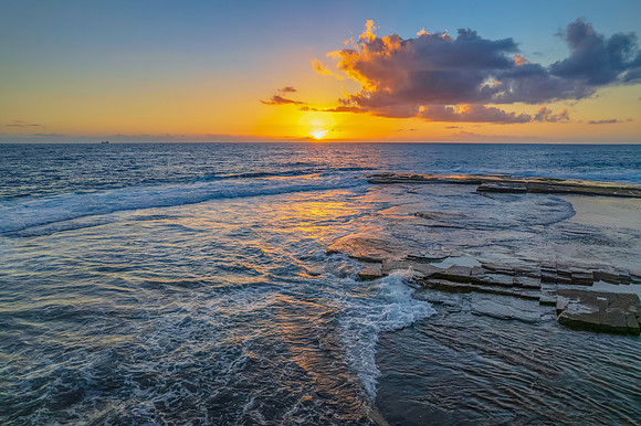 Aerial Sunrise Seascape at Rocky Inlet with clouds