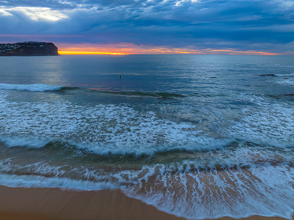 Cloud filled sunrise seascape