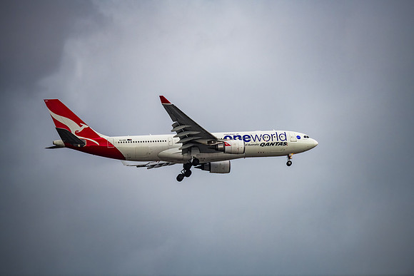 Qantas (Oneworld Livery)VH-EBV Aircraft in the cloudy late after