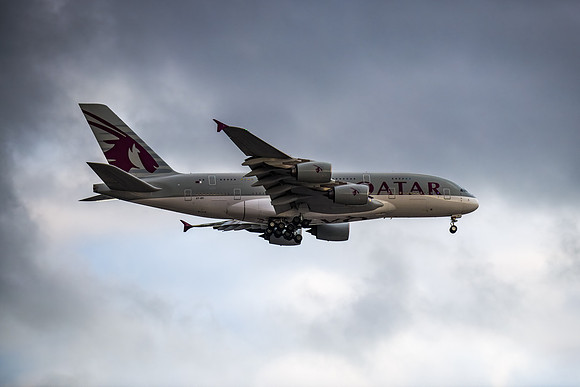 QATAR Airways Airbus coming into land in a grey cloudy sky