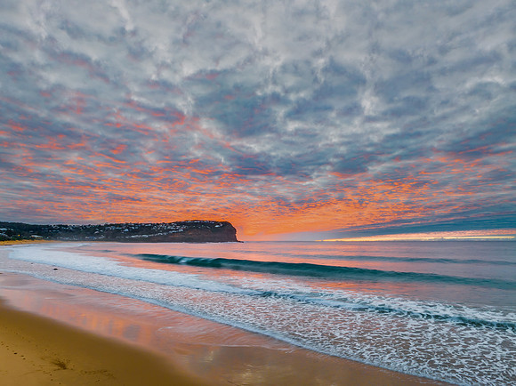 Stratus cloud filled sunrise over the ocean
