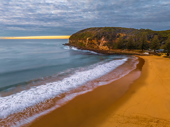 Stratus cloud filled sunrise over the ocean