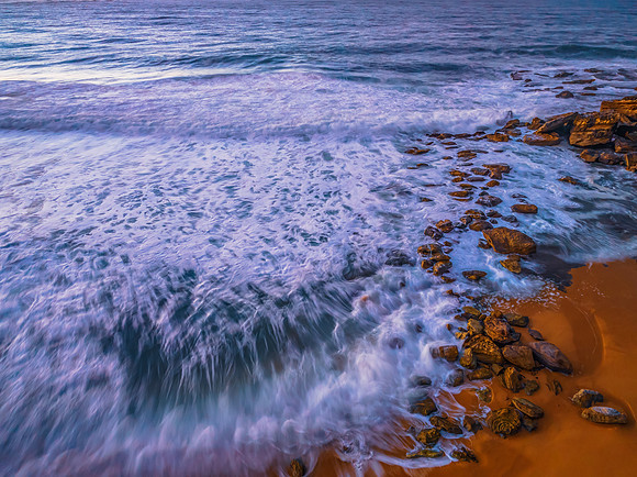Sunrise and waves at the seaside