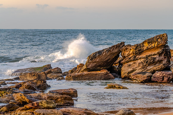 Sunrise and waves at the seaside