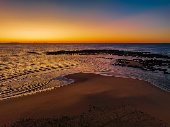 Aerial sunrise seascape with  clear skies
