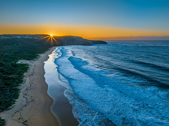 Sunrise and waves at the seaside