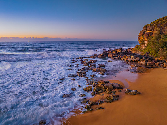 Sunrise and waves at the seaside
