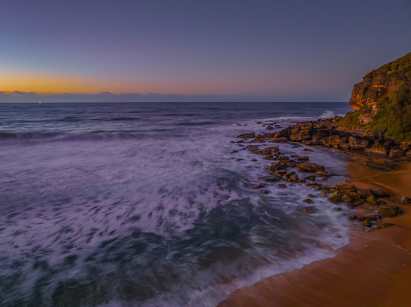 Sunrise and waves at the seaside