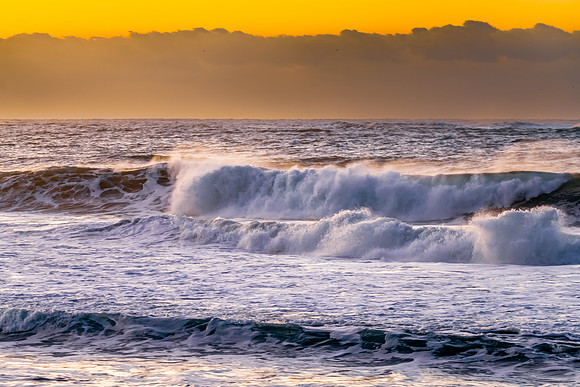 Sunrise and waves at the seaside