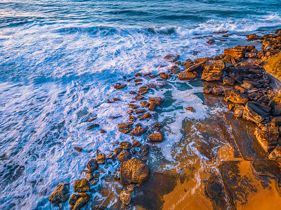 Sunrise and waves at the seaside