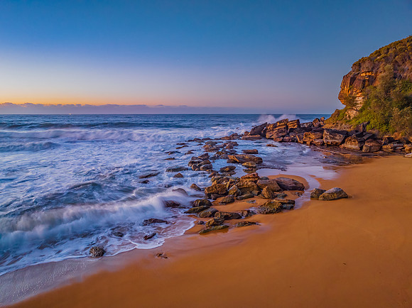 Sunrise and waves at the seaside