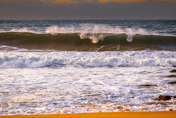 Sunrise and waves at the seaside