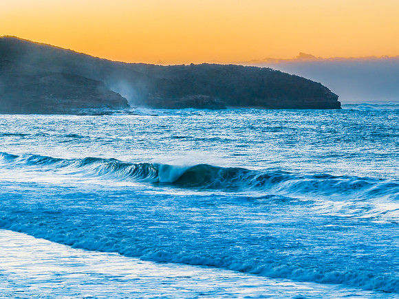 Sunrise and waves at the seaside