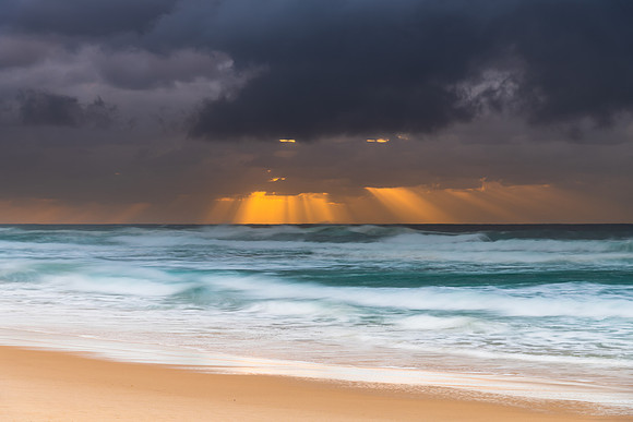 Rainy day moody seascape with sun rays