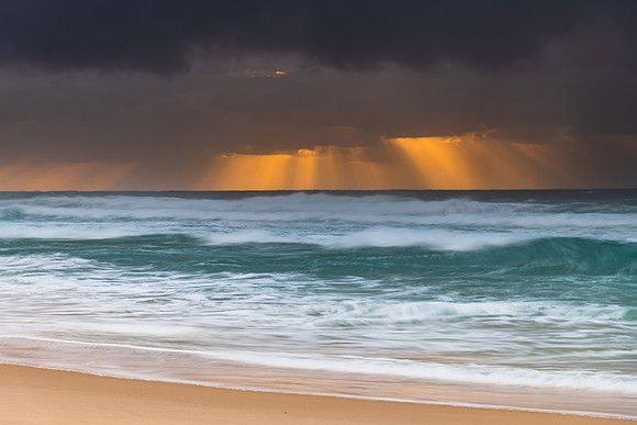 Rainy day moody seascape with sun rays