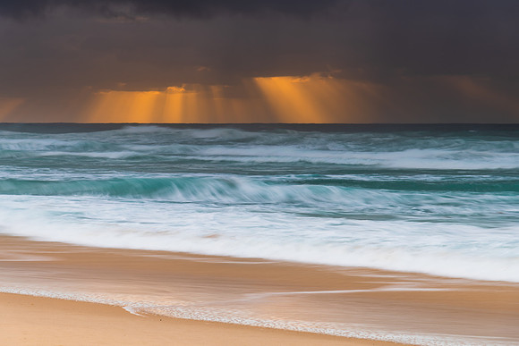 Rainy day moody seascape with sun rays