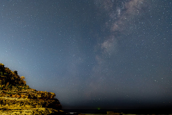 The night sky and the Milky Way with rocky inlet