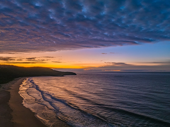 Winter seascape views over the beach with high and medium cloud
