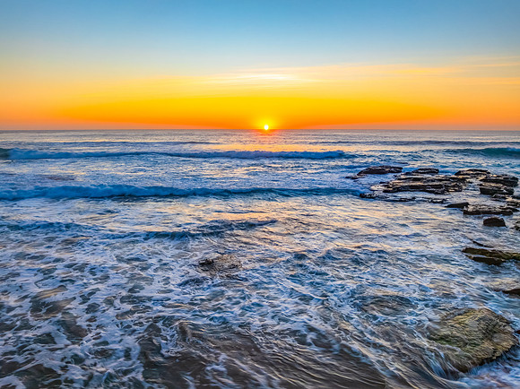 Sunrise at the Seaside with an Orange Horizon