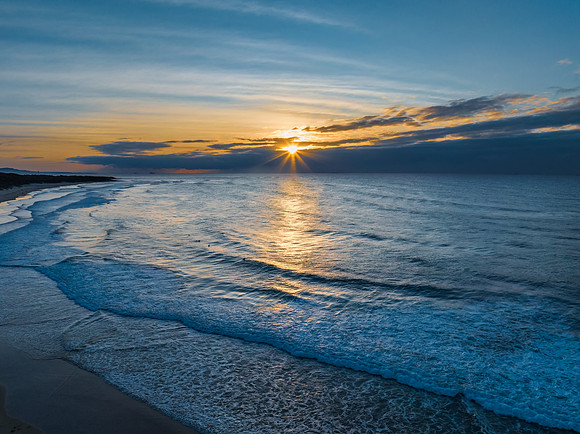 Sunrise seascape with waves
