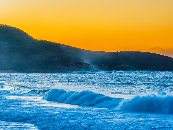 Sunrise and waves at the seaside