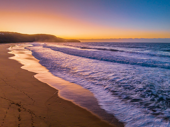 Sunrise and waves at the seaside