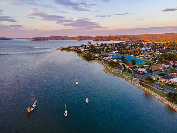 Aerial sunrise waterscape over the channel and boats