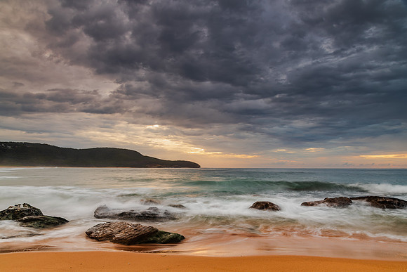 Sunrise at the seaside with rocks