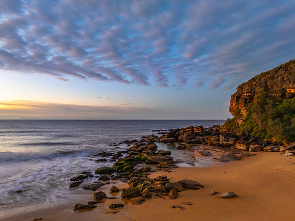 Winter seascape views over the beach with high and medium cloud