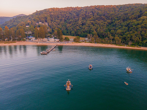 Boats at rest and gentle sunrise over the bay