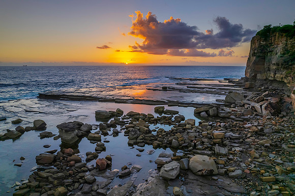 Aerial Sunrise Seascape at Rocky Inlet with clouds
