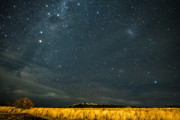 Stargazing at the night sky and milky way with clouds