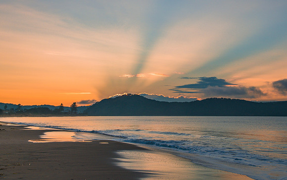 Sunrise Seascape with Blue Sun Beams
