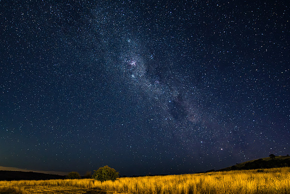 The night sky and Milky Way Galaxy with satellites