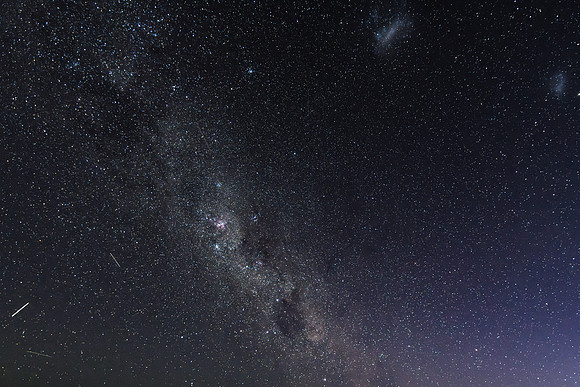 The night sky and Milky Way Galaxy with satellites