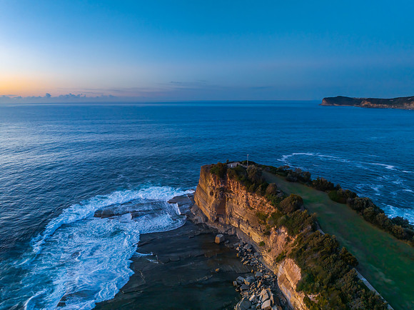 Sunrise over the blue sea and rocky Inlet