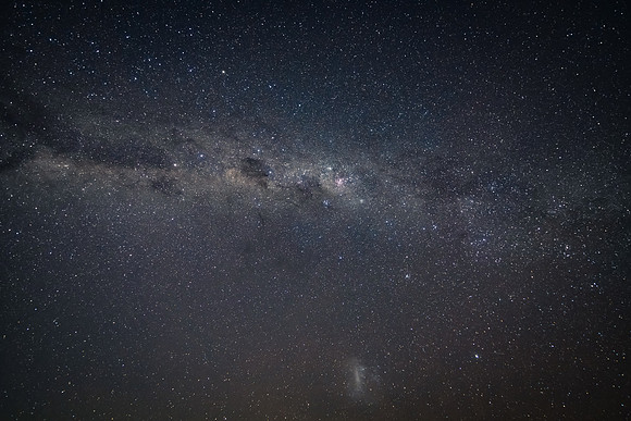 In the dark of the night the stars and milky way sky shine brigh
