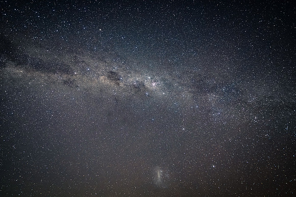In the dark of the night the stars and milky way sky shine brigh