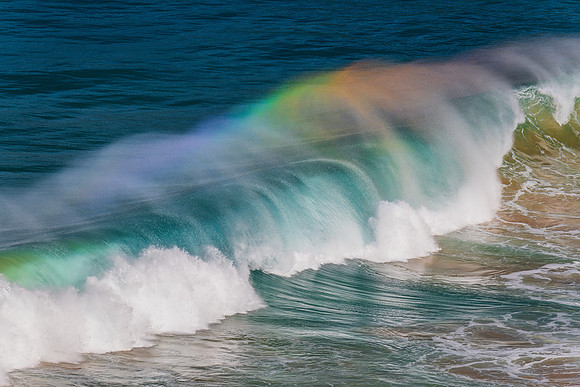 Rainbow light in the Waves at Whale Beach