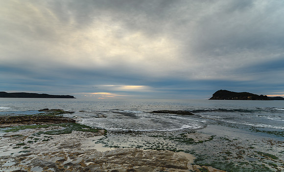 Cloudy Dawn Seascape with Rock Shelf