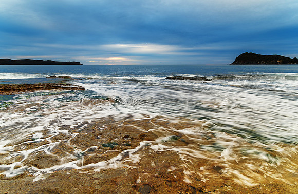 Cloudy Dawn Seascape with Rock Shelf