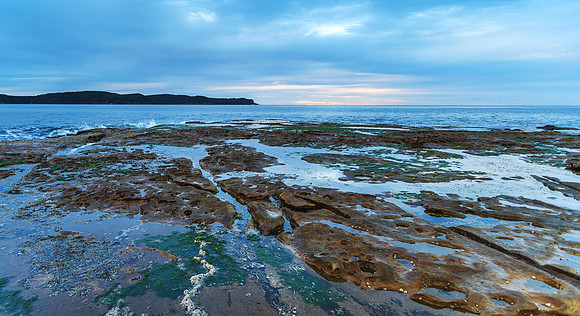 Cloudy Dawn Seascape with Rock Shelf
