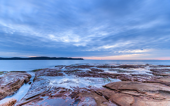 Cloudy Dawn Seascape with Rock Shelf