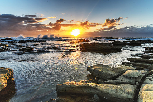 Cloudy and Rocky Sunrise Seascape