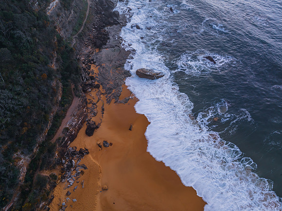 Top down sea and rocks in the very early morning light