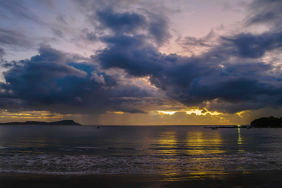 Aerial sunrise at the seaside with rain clouds