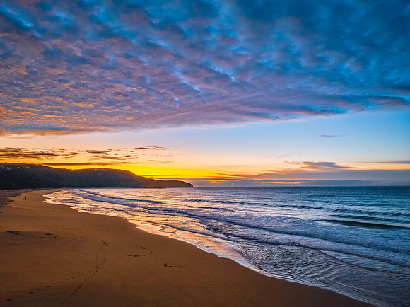 Winter seascape views over the beach with high and medium cloud