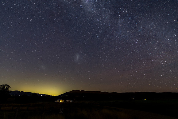 In the dark of the night the stars and milky way sky shine brigh