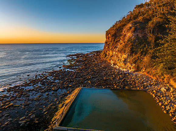 Clear skies and flat surf sunrise seascape